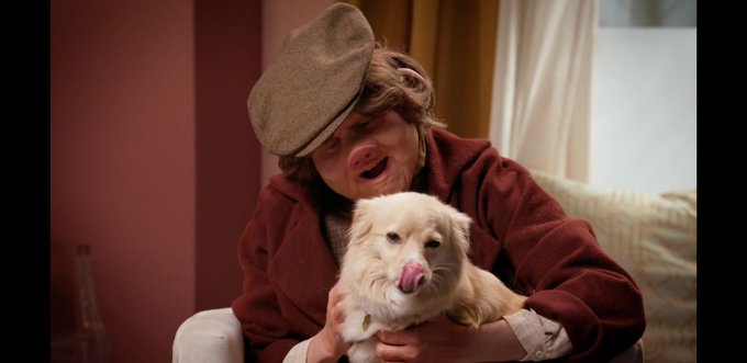 Screenshot from the Dropout TV show "Very Important People" showing Ally Beardsley with David Kerns' dog