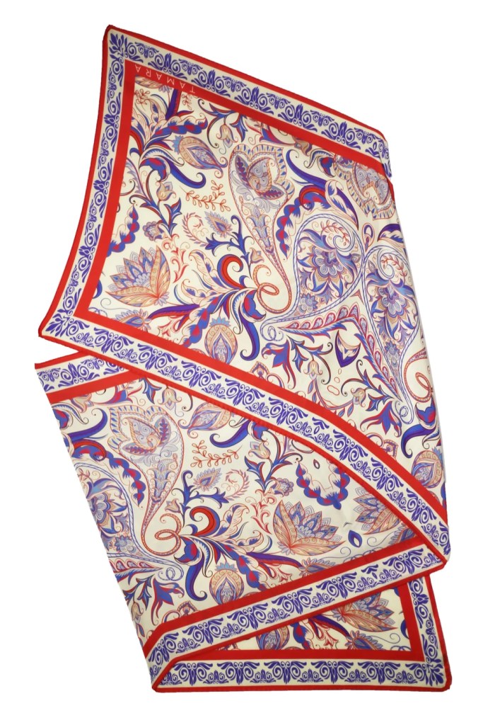 A photo of an Italian silk scarf, made by the company Tamara, decorated with elaborate patterns.